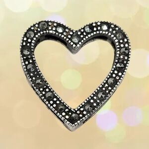 This Sterling .925 Silver Heart Shape Marcasite Stone Slide Open Sides Pendant